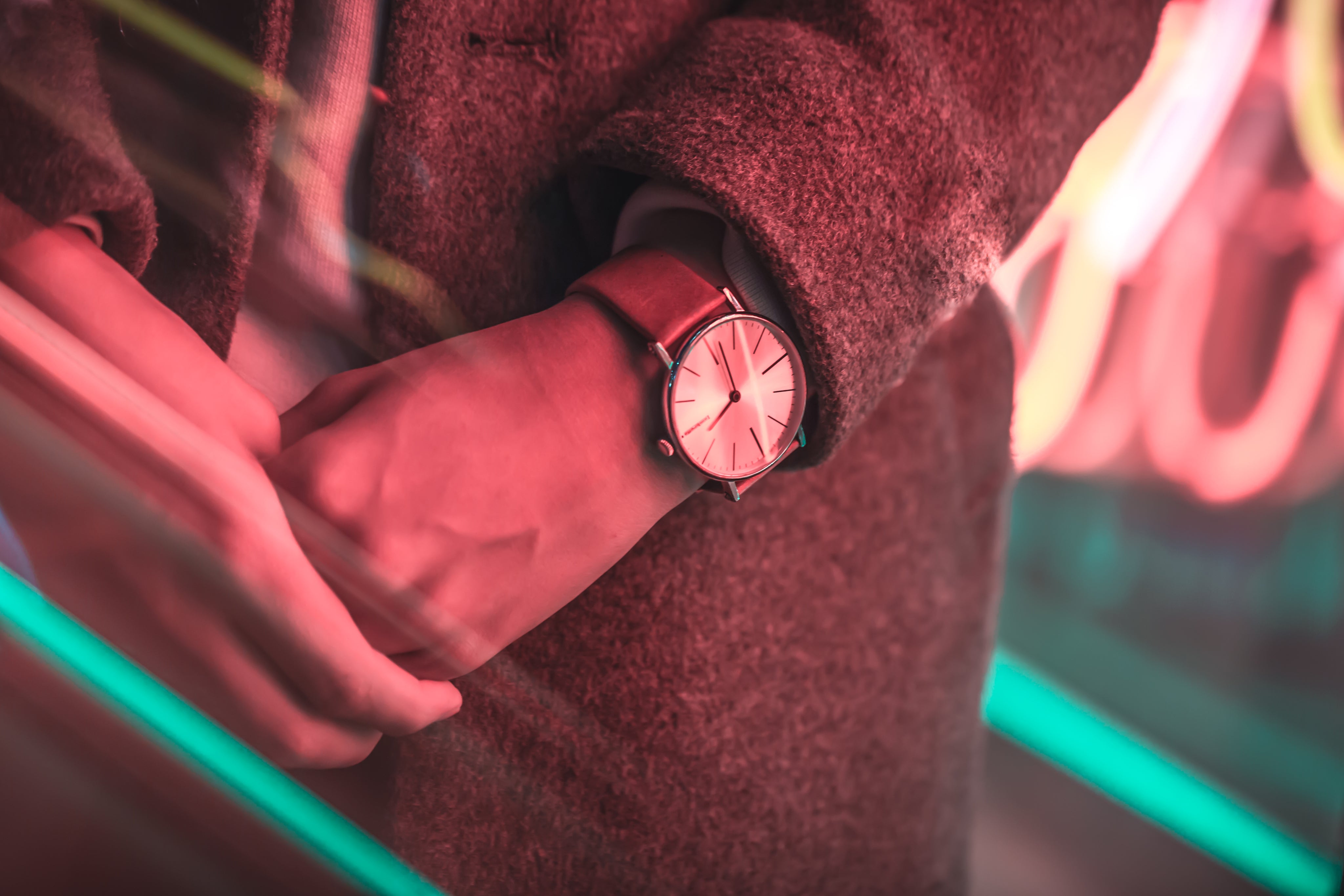 files/close-up-of-watch-signing-under-neon-lights.jpg